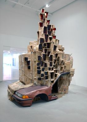 A Permeable Body of Solitude, 2012, 3,5 x 3 x 4 meters, cardboard, glass, plexieglass, car-piece and epoxy. Courtesy Upstream Gallery 