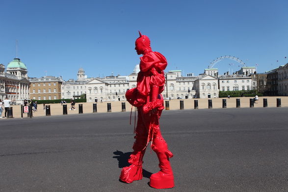 `Devil King` costume and flag design for `Monument Walk I` by Izzy Yon as part of Every Womxn Biennial, London,  2021. Photographer: Yasmine Akim 
